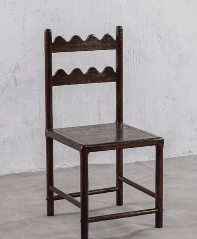 A dark-stained wooden chair featuring a distinctive backrest with two horizontal slats, each carved with a wavy or scalloped edge. It has a simple square wooden seat and straight legs with stretchers. — 3D model