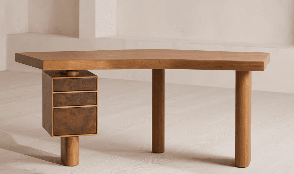 A modern desk featuring an asymmetrical, thick wooden top supported by three rounded legs and a suspended drawer unit. The main structure is light-toned wood, possibly oak, while the drawer fronts are a contrasting darker burl wood veneer. The desk has a distinctive, sculptural quality. — 3D model