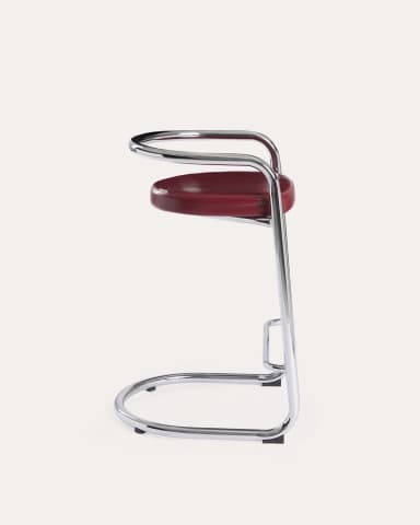 A high bar stool featuring a gleaming tubular chrome frame and a curved, red upholstered seat and backrest. The frame forms a continuous loop from the base, extending upwards to create armrests and a partial back support. The design is sleek and minimalist, characteristic of the Bauhaus and modernist aesthetic. — 3D model