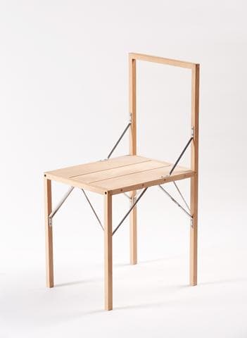 A light-toned wooden folding chair featuring a slatted seat and an open, rectangular backrest, with visible metal hinges and bracing that facilitate its compact storage. — 3D model