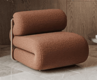 A modern lounge chair featuring a plush, continuously folded upholstered seat and backrest in a warm, textured fabric, supported by a minimalist tubular metal frame. — 3D model