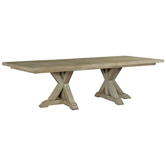 A rectangular dining table with a planked top and a distressed wood finish. It features a double trestle base, with each base constructed from intersecting wooden beams that form an 'X' shape with stacked, tiered rectangular feet. — 3D model