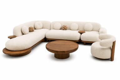 A modern living room furniture ensemble, consisting of a large, curvilinear modular sectional sofa upholstered in a light, textured boucle fabric. The sofa features integrated dark wood side tables and a matching dark wood platform base. Accompanying the sofa is a round coffee table, also made of dark wood, and a small, rounded accent chair upholstered in the same boucle fabric with a wooden base. Decorative round and knot-shaped pillows are placed on the sectional. — 3D model