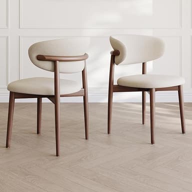 A modern dining chair with a curved backrest and a padded seat. The frame and legs are made of dark wood, with a distinct grain visible. The upholstery is a light, textured fabric. The backrest features a unique wooden accent connecting it to the frame. — 3D model