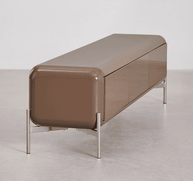 A low-profile, elongated sideboard with a rounded rectangular form. It features three cabinet doors across the front and stands on four slender, angled metal legs. The overall design appears modern and minimalist, with a smooth, matte finish. — 3D model