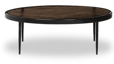 An oval coffee table with a dark, textured top and a thin black frame. It is supported by four slender, tapered black legs. — 3D model