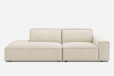 A modern, modular sectional sofa featuring an integrated chaise lounge, upholstered in a light, neutral-toned woven fabric with distinct piping details defining its clean, geometric lines. — 3D model