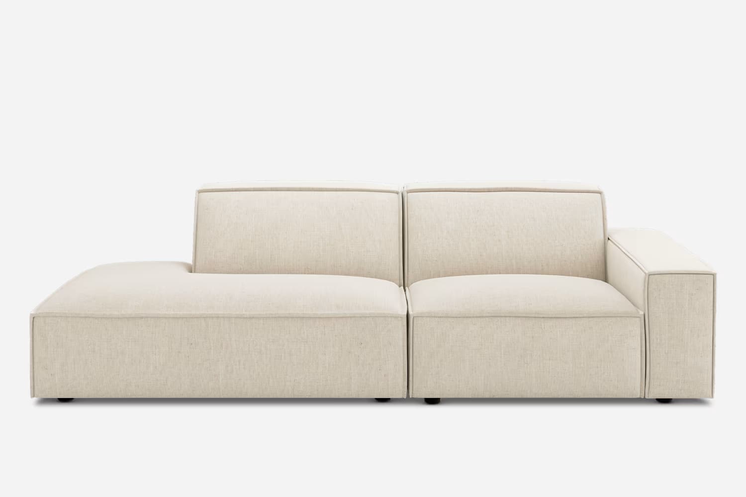 A modern, modular sectional sofa featuring an integrated chaise lounge, upholstered in a light, neutral-toned woven fabric with distinct piping details defining its clean, geometric lines. — 3D model