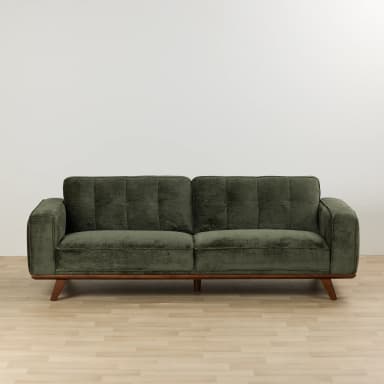 A two-seater sofa with green fabric upholstery, featuring tufted back cushions, square track arms, and an exposed wooden base with tapered wooden legs. — 3D model