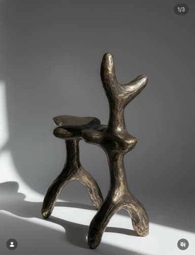 A highly sculptural bronze stool or pedestal, characterized by its abstract, organic forms and textured, dark patinated finish. Its design evokes brutalist and organic modern aesthetics. — 3D model