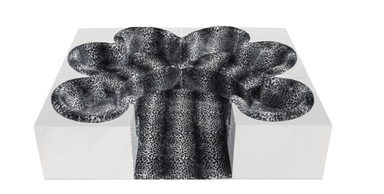 A modular lounge seating system composed of stark white geometric blocks with integrated, organically shaped seating depressions upholstered in a bold black and white leopard print fabric. — 3D model