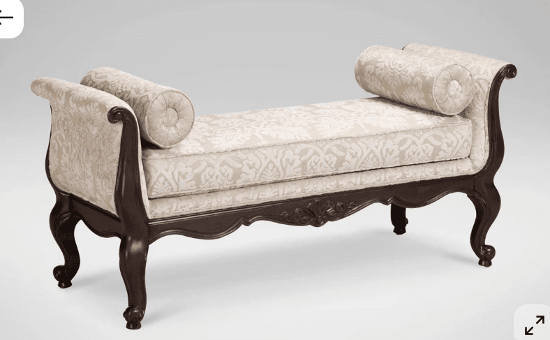 A traditional style Recamier chaise lounge featuring a dark carved wood frame with ornate detailing and cabriole legs, upholstered in a light, patterned damask fabric, and accompanied by two cylindrical bolster pillows. — 3D model