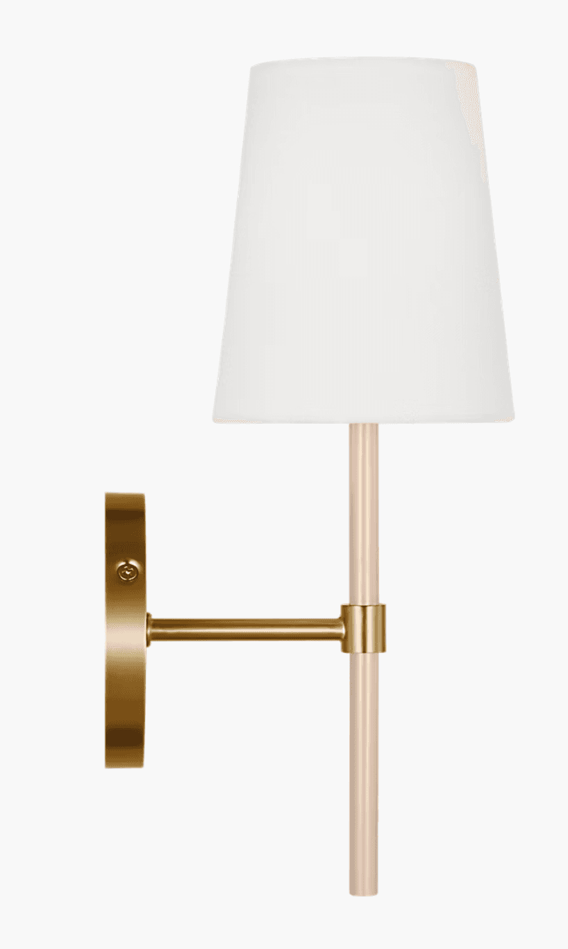 A modern wall sconce featuring a circular brass wall plate, an extending brass arm, and a vertical light-colored acrylic rod from which a white tapered fabric shade is suspended. The brass components have a brushed or satin finish, contributing to a contemporary aesthetic. — 3D model