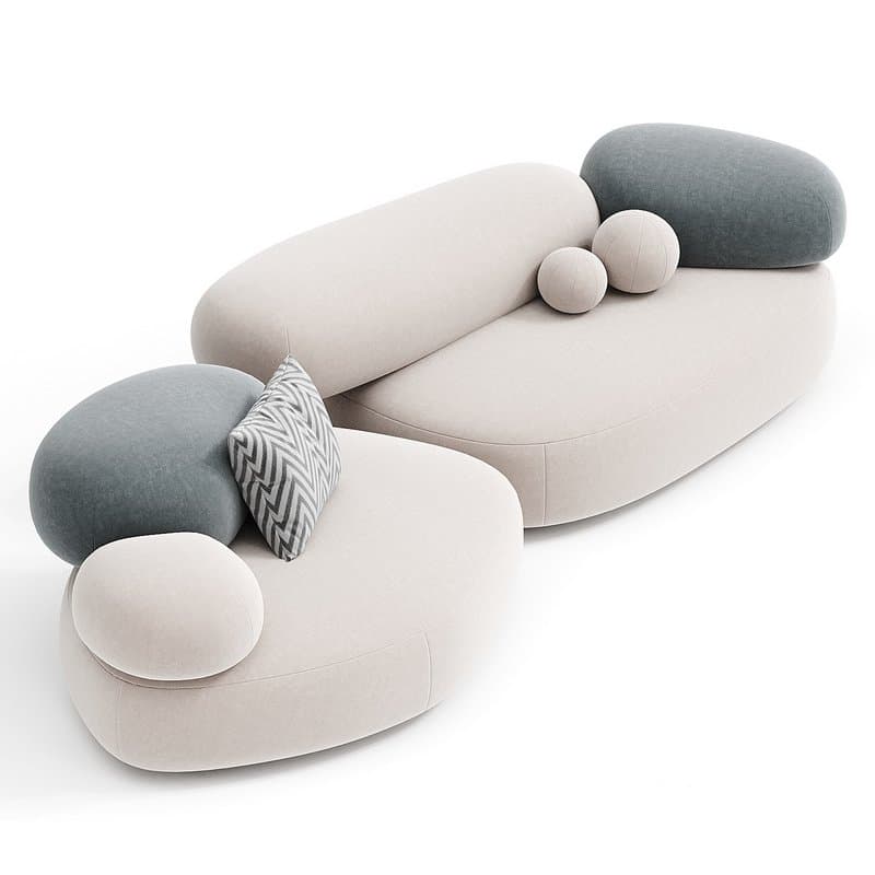 A modern, low-profile modular sectional sofa composed of multiple rounded, organic-shaped upholstered units. The main body is light beige, complemented by muted teal-grey and patterned accent pillows. — 3D model