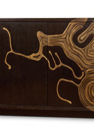 A long, rectangular credenza crafted from dark-stained wood, featuring multiple cabinet doors. The facade is adorned with a striking abstract brass inlay design that spans across the panels, creating a dynamic, flowing, topographic-like pattern. The credenza rests on a recessed plinth base. — 3D model