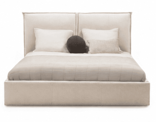 A modern upholstered platform bed featuring a low-profile frame and a tall, two-panel headboard, all covered in a light beige fabric. The bed is styled with minimalist bedding including a quilted duvet and accent pillows. — 3D model