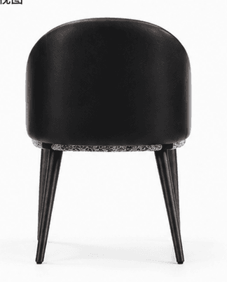 A contemporary upholstered armchair featuring a black, smoothly curved backrest and integrated armrests. The seat cushion is upholstered in a contrasting white and gray patterned fabric. The chair is supported by four dark, tapered wooden legs, lending it a sleek and modern appearance. — 3D model