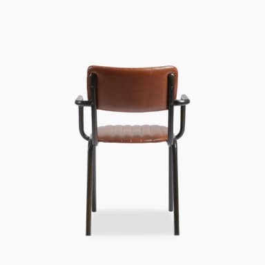 A modern armchair with a low back and armrests. The seat and backrest are upholstered with brown material featuring vertical channel tufting. The frame and legs are constructed from black metal, forming a minimalist silhouette. — 3D model