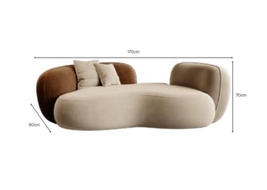 A large, modern upholstered daybed featuring a curvilinear, biomorphic form. The main lounging surface is a light beige/greige fabric, transitioning into a contrasting dark brown backrest on one side and a smaller, lighter backrest on the other. It includes two decorative pillows on the brown section. The design emphasizes soft, rounded edges and a sculptural aesthetic. — 3D model
