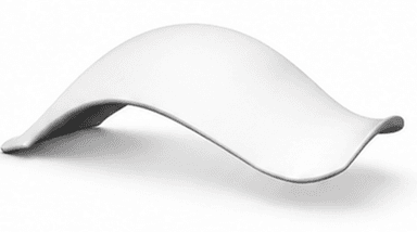 A contemporary bench with a flowing, organic design. The bench has a smooth, curved surface that appears to be made from a single piece of material, creating a seamless and minimalist aesthetic. It is presented in a studio setting against a plain white background. — 3D model