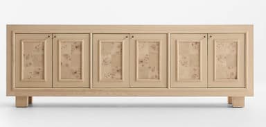 A modern sideboard featuring a light-toned wooden frame and four cabinet doors. Each door has a recessed panel design, with the inner panel adorned with a distinctive burl wood veneer. The sideboard rests on four short, solid block feet. The overall aesthetic is clean and contemporary, with natural wood textures. — 3D model