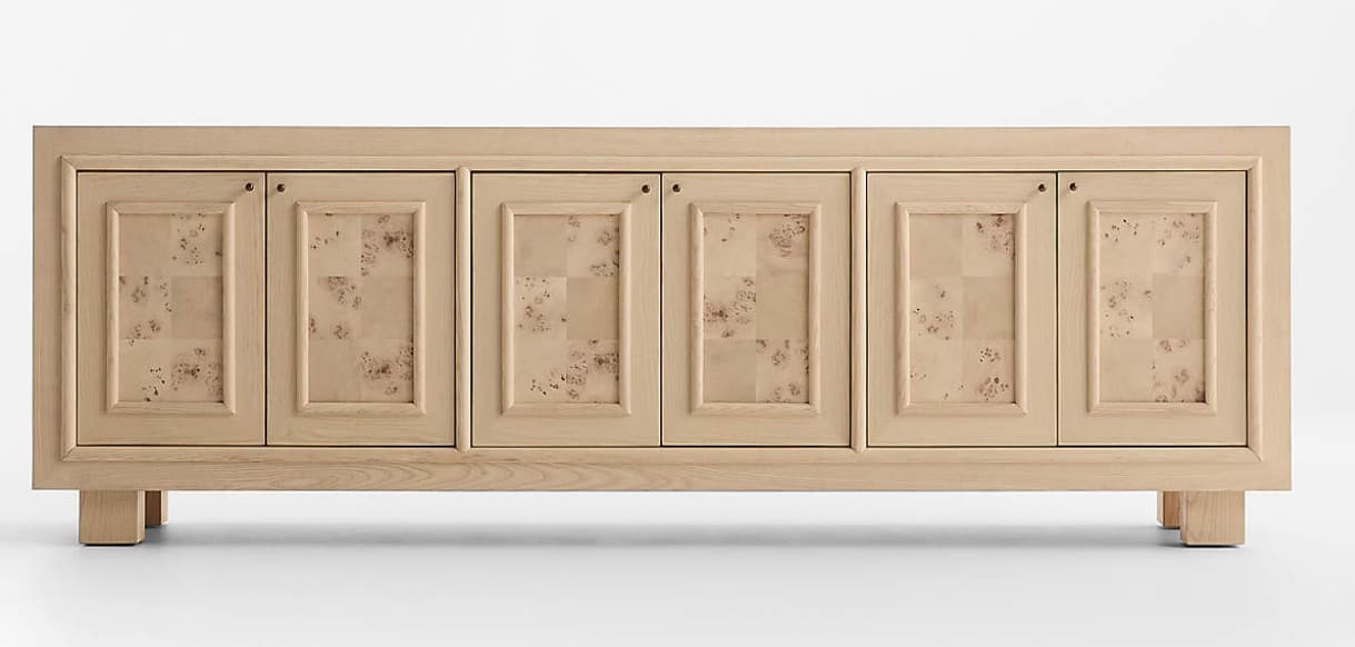 A modern sideboard featuring a light-toned wooden frame and four cabinet doors. Each door has a recessed panel design, with the inner panel adorned with a distinctive burl wood veneer. The sideboard rests on four short, solid block feet. The overall aesthetic is clean and contemporary, with natural wood textures. — 3D model