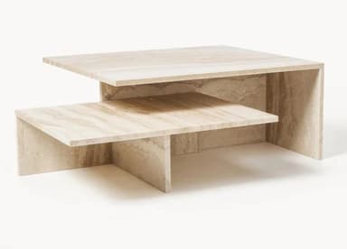 A tiered coffee table constructed from travertine stone, featuring a lower shelf and a higher, larger top surface. The design is geometric and minimalist, with the natural veining of the stone prominently displayed. — 3D model