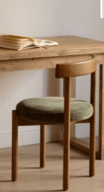 A minimalist dining chair featuring a light-toned solid wood frame, a gently curved wooden backrest, and a circular seat upholstered in an olive green ribbed fabric. It stands on four slender, round wooden legs. — 3D model