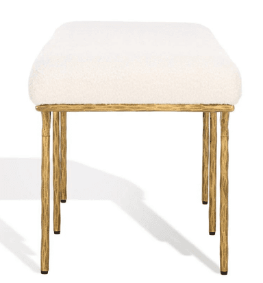 A long, upholstered bench with a rounded top and a slender, artistic metal base. The base features four legs that curve outwards from the underside of the seat, creating an open, sculptural form. The legs have a textured, organic appearance. — 3D model