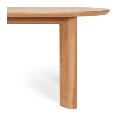 An oval dining table crafted from light-colored solid oak wood, featuring a smooth, rounded tabletop and four thick, rectangular-profile legs. — 3D model