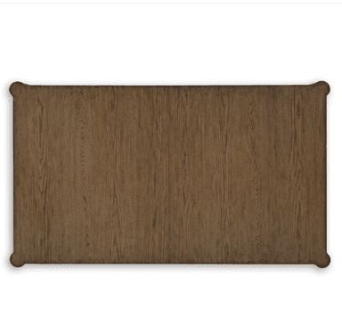 A rectangular dining table crafted from solid wood or wood veneer, featuring a medium brown finish that highlights the natural grain. It stands on four outwardly splayed, tapered legs, supporting a substantial tabletop with subtly rounded corners and a minimalist apron. — 3D model