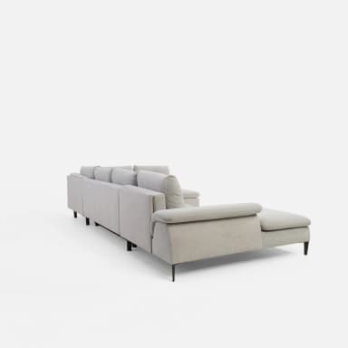 A U-shaped sectional sofa with light grey fabric upholstery. The sofa features tufted back cushions and a chaise lounge on one end and a rounded armrest on the other. It is supported by dark, tapered legs. — 3D model