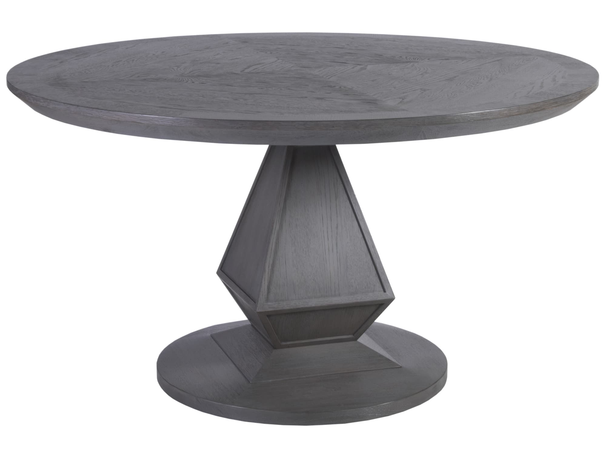 A round dining table with a pedestal base. The tabletop has a distinct wood grain pattern arranged in a radiating or chevron-like design. The pedestal base is multi-faceted, with geometric shapes and stepped detailing, tapering from a wider circular foot to a narrower central column supporting the tabletop. The entire piece exhibits a consistent dark gray, weathered wood finish. — 3D model