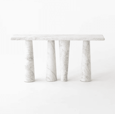 A minimalist and sculptural console table crafted entirely from white marble with subtle grey veining. The table features a rectangular top supported by a uniquely designed base consisting of organically curved or twisted marble pillars, giving it a solid and artistic appearance. The surfaces are polished, enhancing the natural beauty of the stone. — 3D model