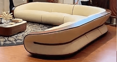 An L-shaped sectional sofa featuring smooth cream-colored upholstery and prominent dark wood trim along its curved backrests and armrests. The design is modern and sophisticated, with segmented cushions. — 3D model