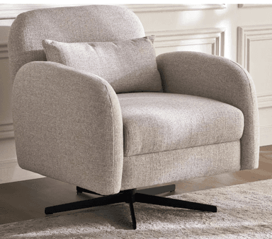 An upholstered swivel accent chair featuring a contemporary design. It has a plush, light beige or oatmeal-colored textured fabric upholstery, characterized by soft, rounded lines for the backrest and armrests. The chair includes a matching loose lumbar pillow for added comfort. It is supported by a sleek, black four-star metal swivel base, allowing for rotational movement. — 3D model