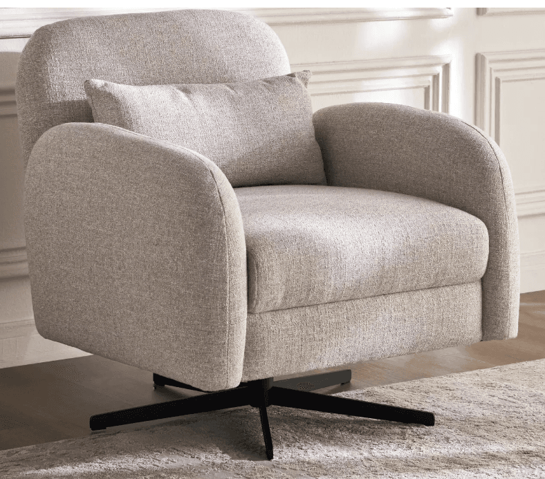 An upholstered swivel accent chair featuring a contemporary design. It has a plush, light beige or oatmeal-colored textured fabric upholstery, characterized by soft, rounded lines for the backrest and armrests. The chair includes a matching loose lumbar pillow for added comfort. It is supported by a sleek, black four-star metal swivel base, allowing for rotational movement. — 3D model