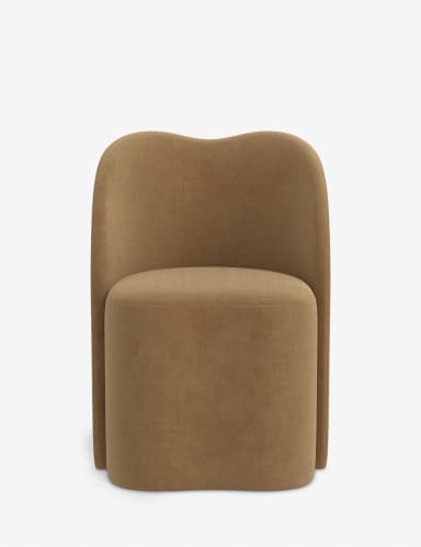 The item is a single-seater upholstered chair with a continuous, gently curved back and integrated armrests, creating a semi-enclosed, inviting form. It is covered in a camel or brownish-beige textured fabric, likely a woven textile. The base is not visible, suggesting a fully upholstered design extending to the floor or very low, concealed legs. — 3D model