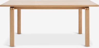 A rectangular dining table constructed from light-colored solid oak wood. It features a simple, clean design with a thick tabletop and four sturdy square-profile legs. The legs are visibly joined to the tabletop's apron structure with exposed finger joints, highlighting the craftsmanship. — 3D model
