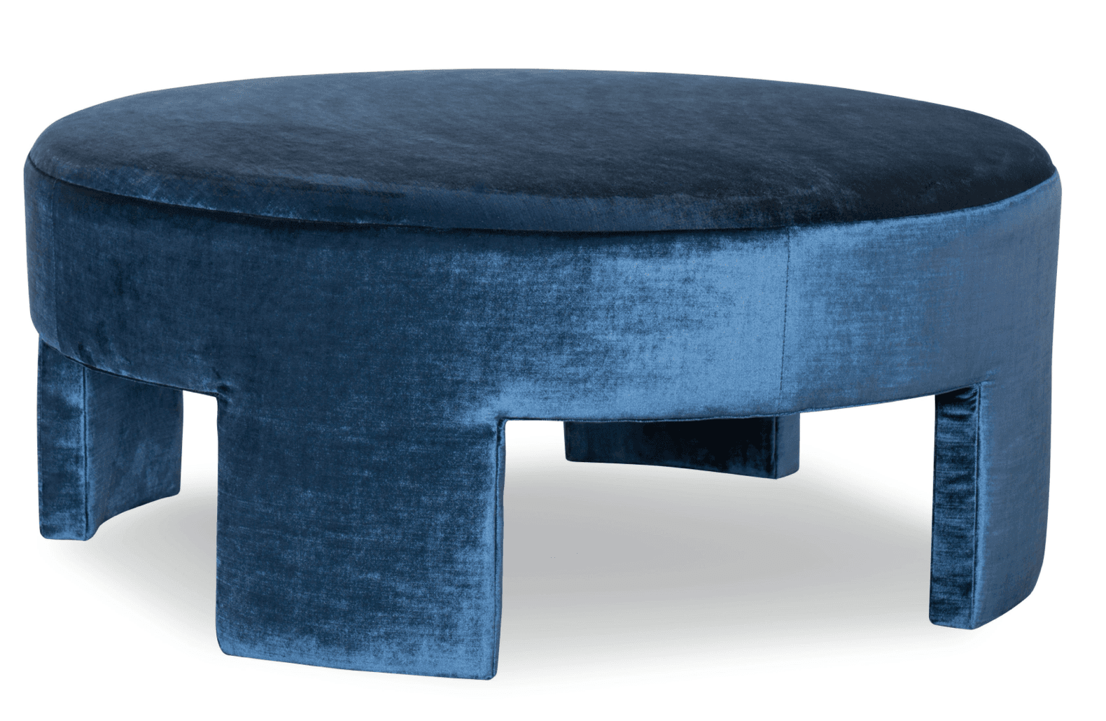 A round, fully upholstered ottoman featuring deep blue velvet fabric and a distinctive cut-out base design. — 3D model
