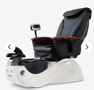 This is a modern pedicure spa chair featuring a plush black faux leather upholstered armchair with integrated massage controls, set upon a sleek white base that houses a textured, purple-tinted footbath. The chair includes padded head and armrests, with the armrests featuring polished wooden accents and a remote control for various functions. The footbath section has chrome fixtures for water dispensing and drainage. — 3D model