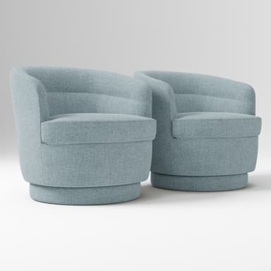 A contemporary upholstered swivel chair featuring a rounded, compact silhouette. It has integrated arms that flow seamlessly from the low backrest, which shows subtle horizontal channel tufting. The chair is covered in a textured light blue fabric and sits on a matching drum-shaped swivel base. — 3D model