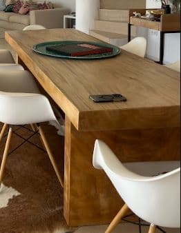 A minimalist rectangular coffee table constructed from light-colored wood. It features a simple, clean design with a thick tabletop and four sturdy block legs positioned at each corner. — 3D model