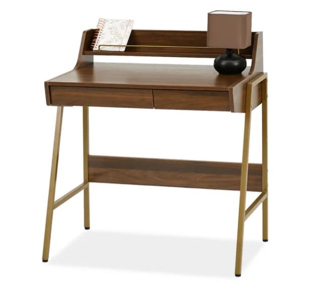 A contemporary desk featuring a dark walnut-effect finish on its top surface, integrated hutch, and two drawers, supported by a geometric brass-finished metal A-frame base. — 3D model