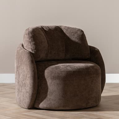 A contemporary upholstered lounge chair featuring a plush, rounded barrel silhouette in a taupe-brown textured fabric. The chair has integrated armrests and a thick, comfortable backrest, offering a cocoon-like seating experience. Its design emphasizes softness and comfort, suitable for modern living spaces. — 3D model