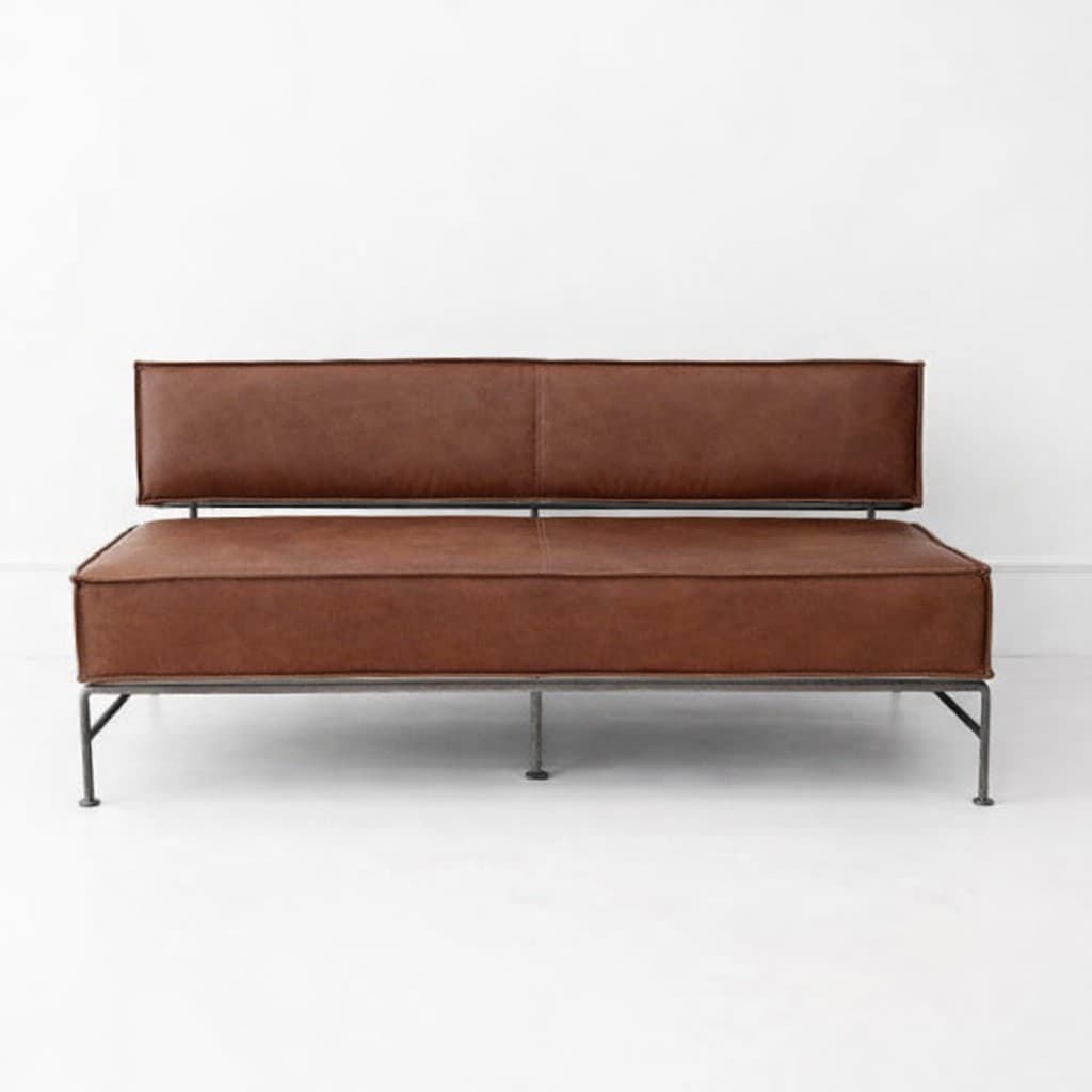 A modern two-seater sofa with a metal frame and brown leather upholstery. The sofa features a low-profile design with a rectangular seat and backrest. The backrest is a single padded cushion, while the seat is also a single padded cushion. The frame is composed of thin, dark-colored metal legs and a supporting structure visible beneath the cushions. The leather has visible stitching details. — 3D model