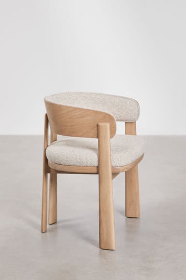 A modern dining chair featuring a solid light oak wood frame and light-colored textured fabric upholstery. The chair has a gently curved backrest that seamlessly transitions into integrated armrests, forming a barrel-like shape. The legs are robust and subtly tapered, contributing to its minimalist and contemporary aesthetic. The seat and inner backrest are cushioned. — 3D model