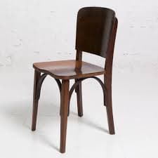 A wooden chair with a curved backrest and a padded seat. The chair has four legs and appears to be of vintage design. The wood is stained a dark brown, and the seat is upholstered in a dark fabric. — 3D model