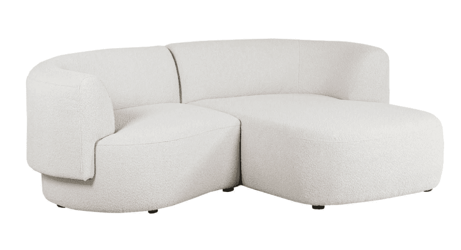 A modern curved modular sectional sofa upholstered in white or off-white boucle fabric, featuring a left-arm section connected to an armless chaise lounge component, resting on subtle recessed dark feet. — 3D model