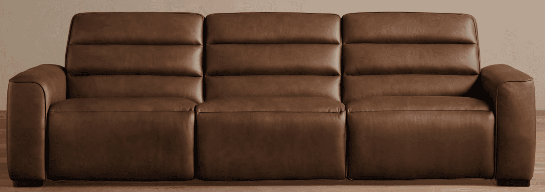 A three-seater sofa with a sleek, modern design. The sofa features channel tufting on the back cushions and seat cushions, creating a segmented appearance. The armrests are slightly rounded and integrated into the main body of the sofa. The sofa appears to be upholstered in a smooth, rich brown leather. — 3D model